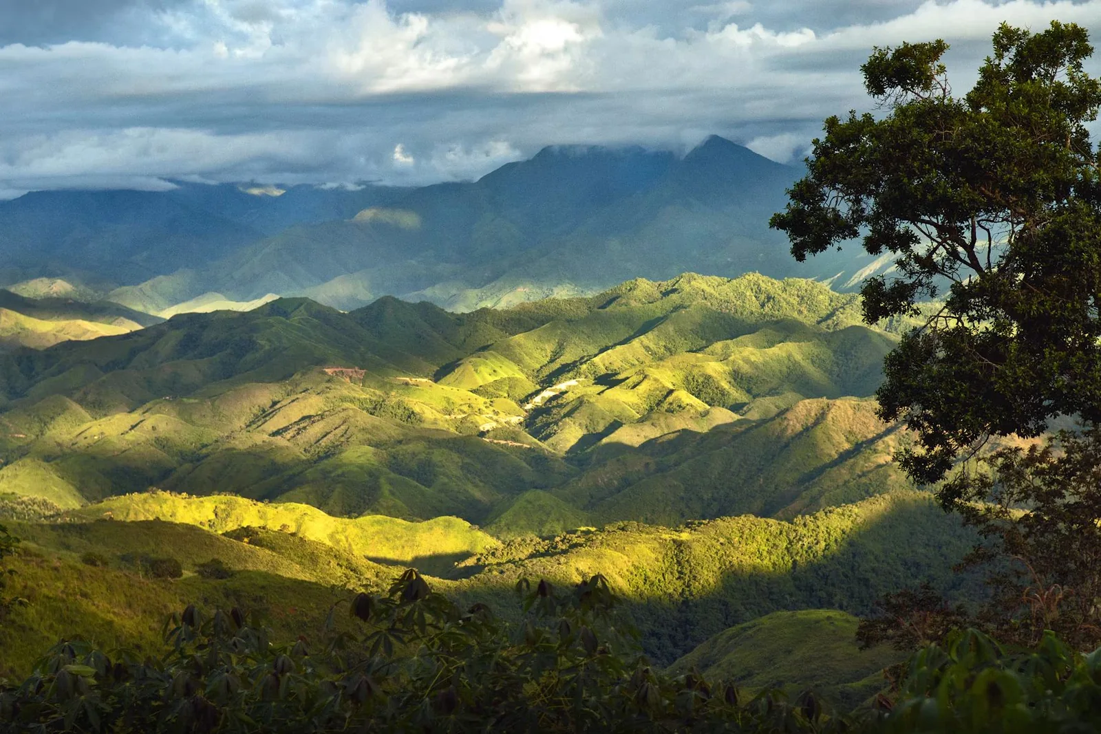 Green mountain valleys in Central America under a cloudy sky